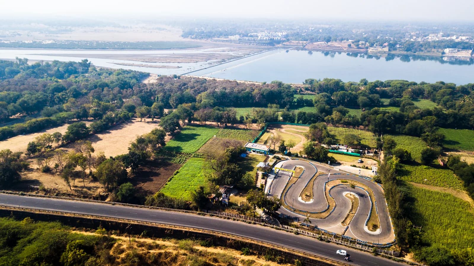 Aerial view of Erda's Speedway Track B in Vadodara beside the river
